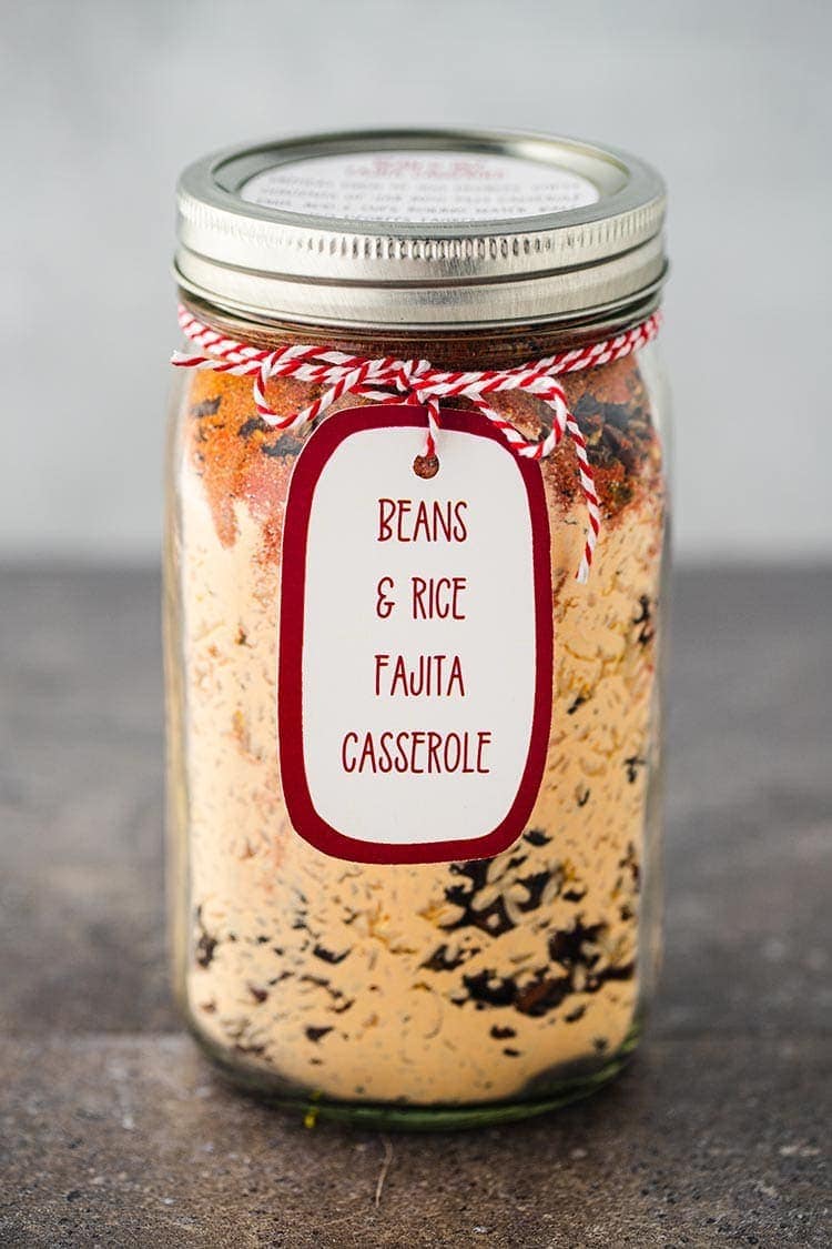 Bean & Rice Fajita Casserole in a jar, sitting on a coutertop, with label and gift tag.