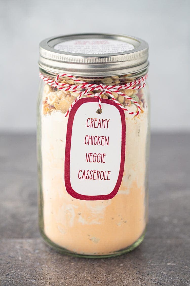 Creamy Chicken Veggie Casserole Meal in a jar, on a countertop, with label and tag in a wide-mouth mason jar.