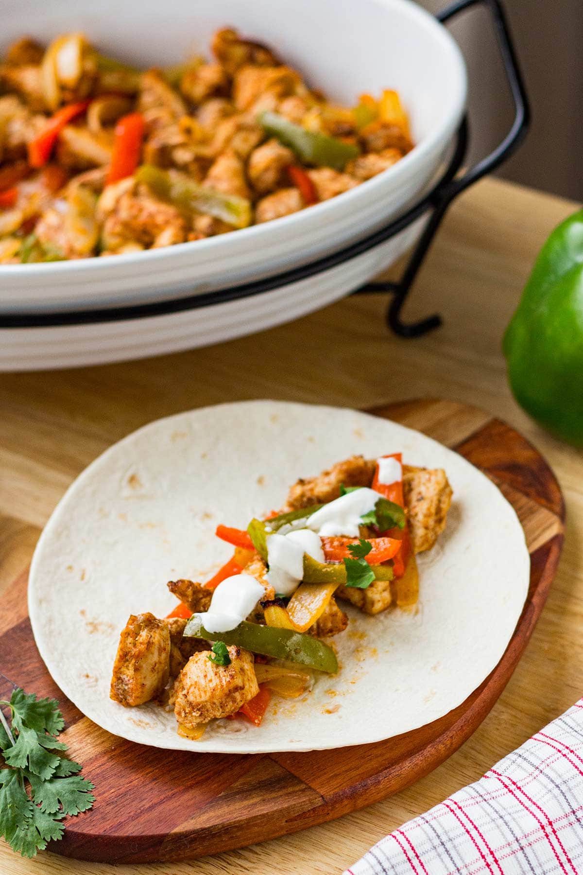 Make-Ahead Chicken Fajita meat in a tortilla.