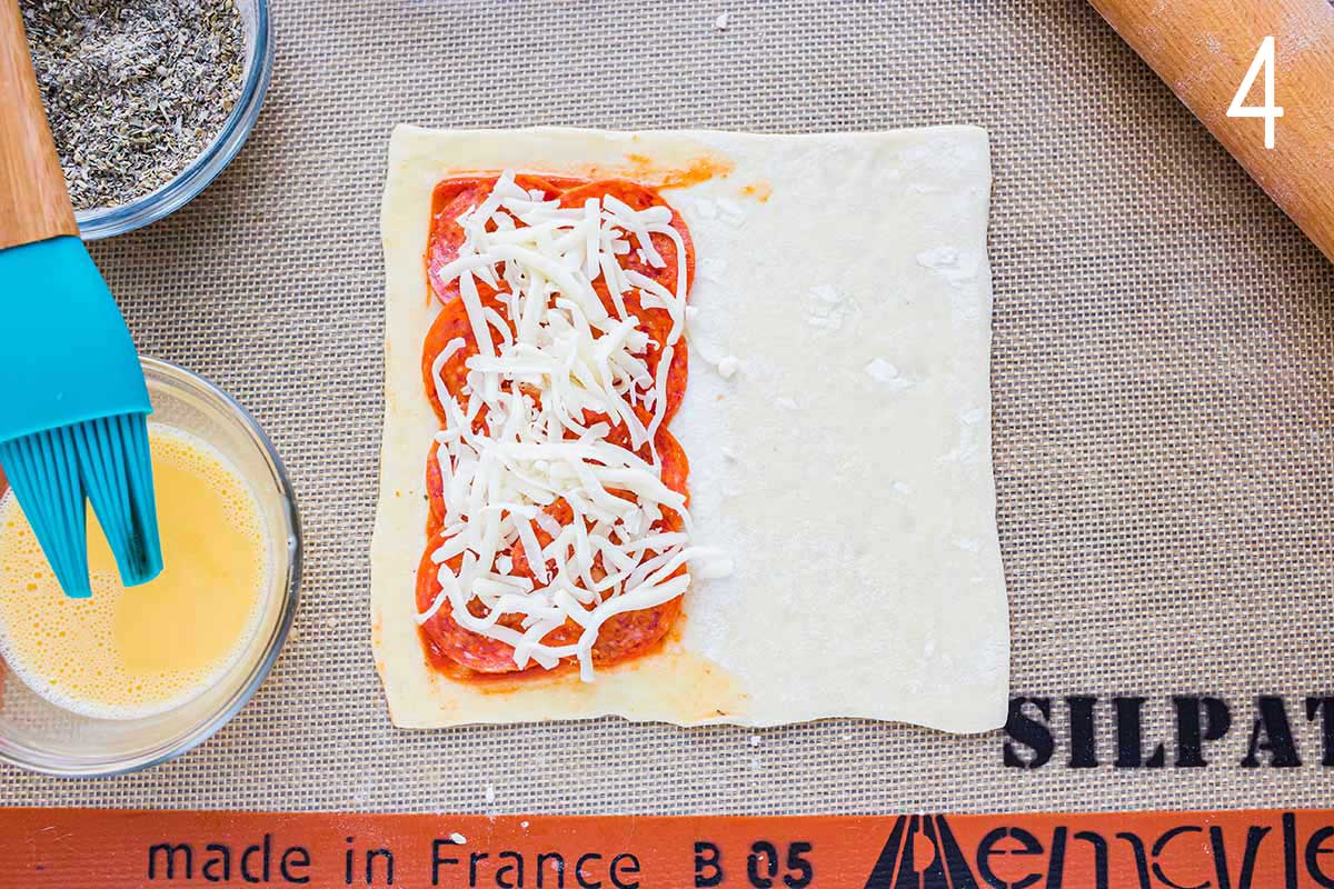 Overhead shot showing egg wash applied to pastry.