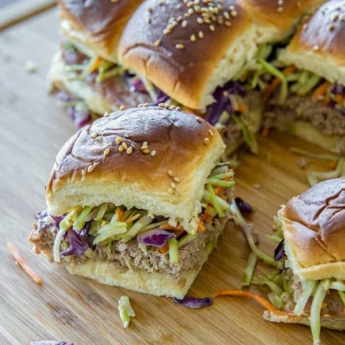 Teriyahi Sliders with broccoli slaw, on cutting board ready to eat