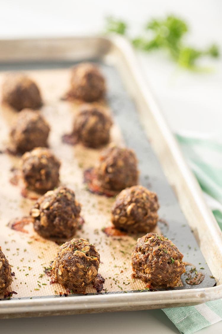 Easy Baked Freezer Meatballs on a baking sheet after being baked in the oven.