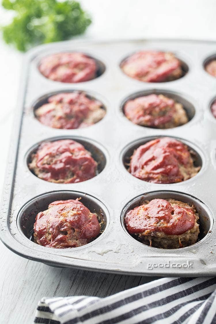 Mini Mozzarella Meatloaf Muffins in a muffin tray after coming out of the oven