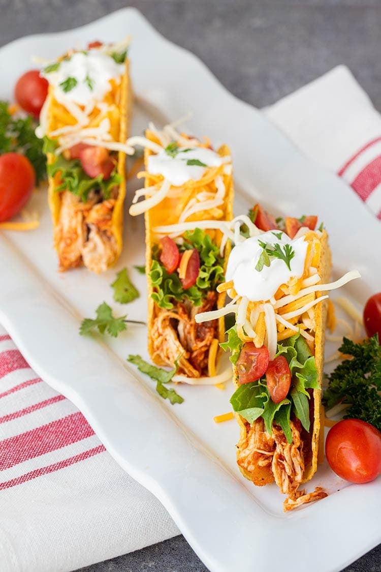 Platter of three tacos made using Instant Pot Salsa Chicken.