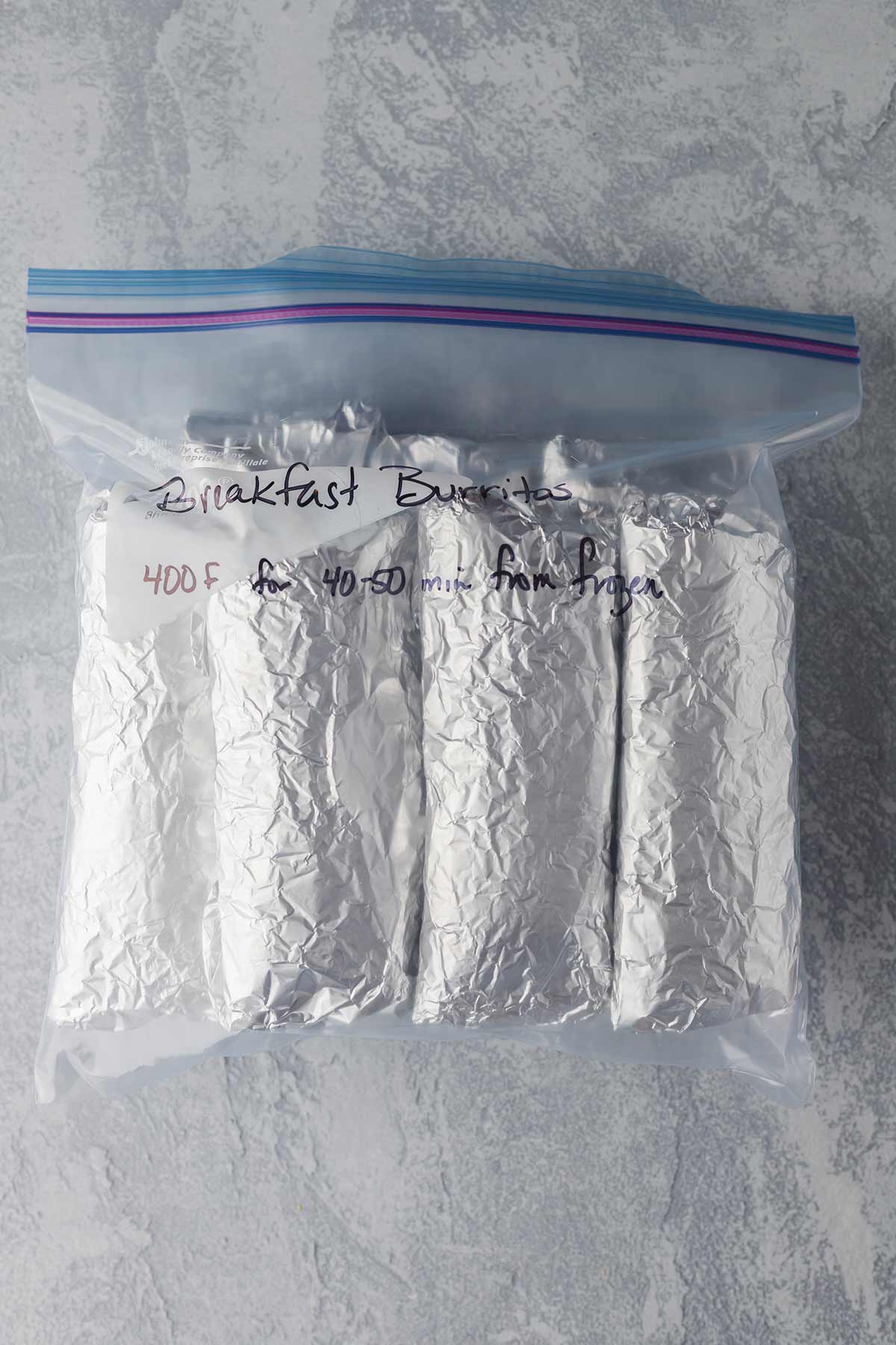 Picture of frozen breakfast burritos prepared for the freezer.