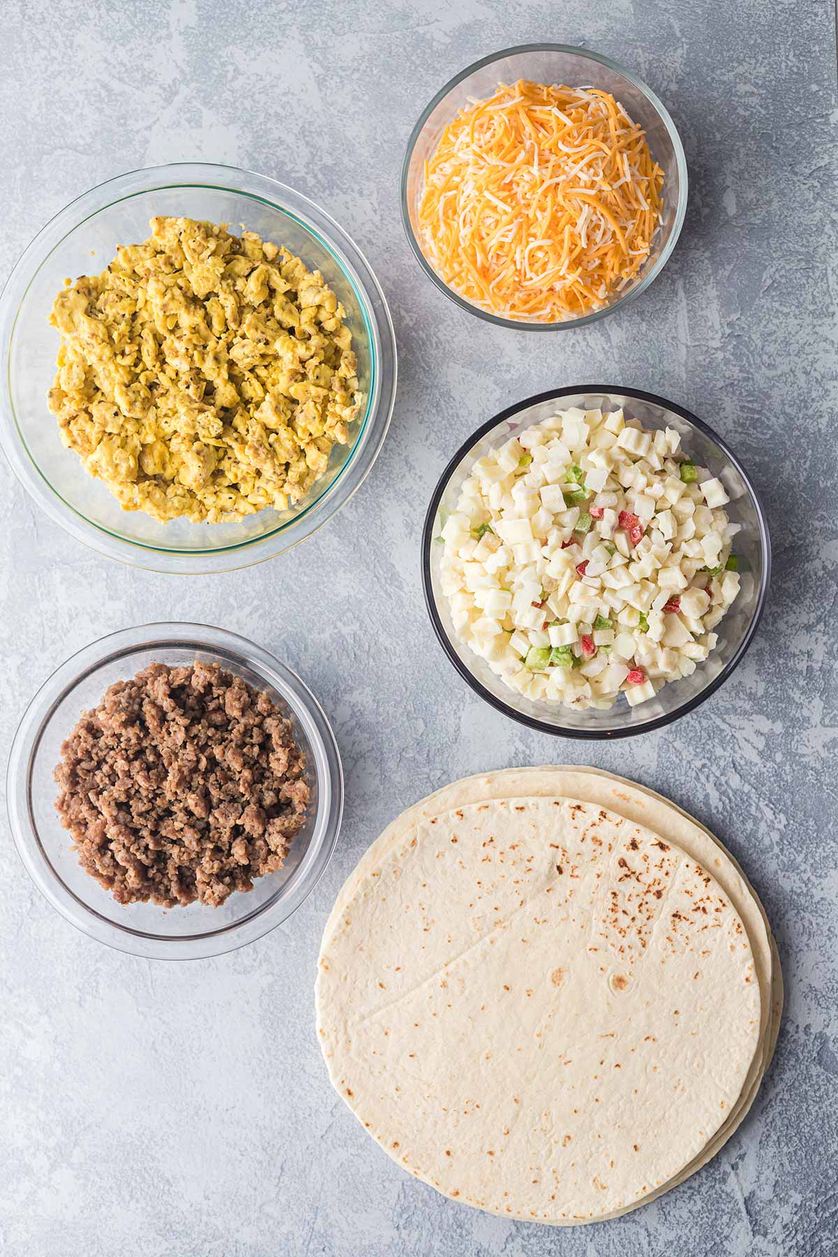 OVerhead shot of ingredients for making freezer breakfast burritos.