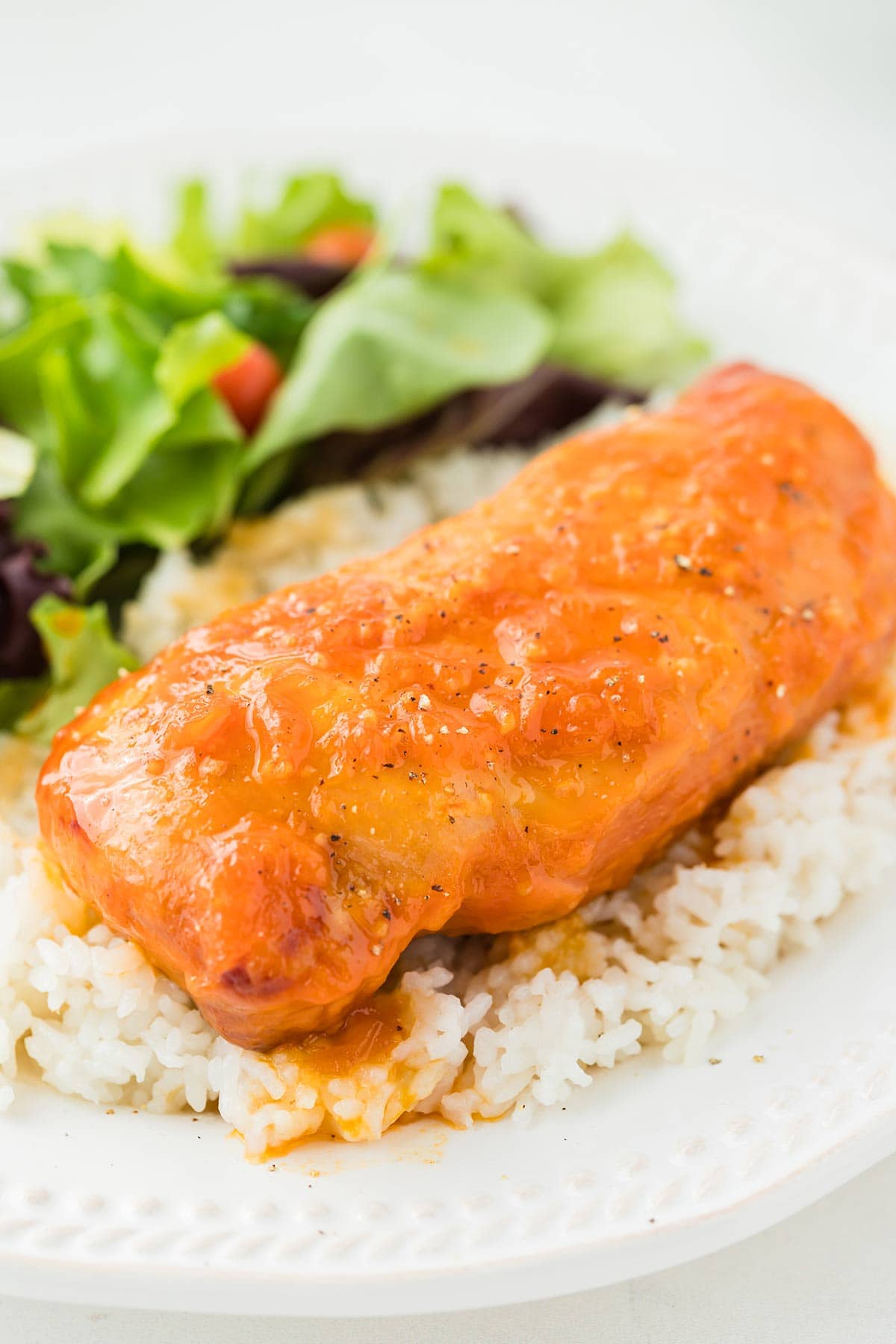 Slow Cooker Apricot Chicken on a bed of rice.