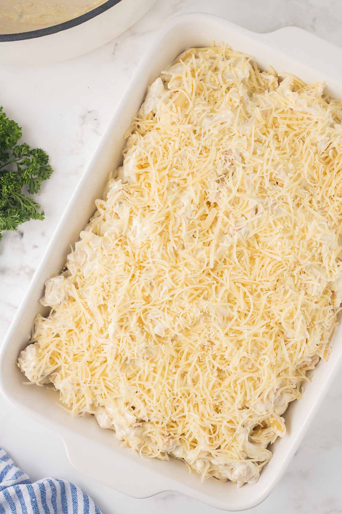 Preparing Chicken Alfredo Bake for freezing.