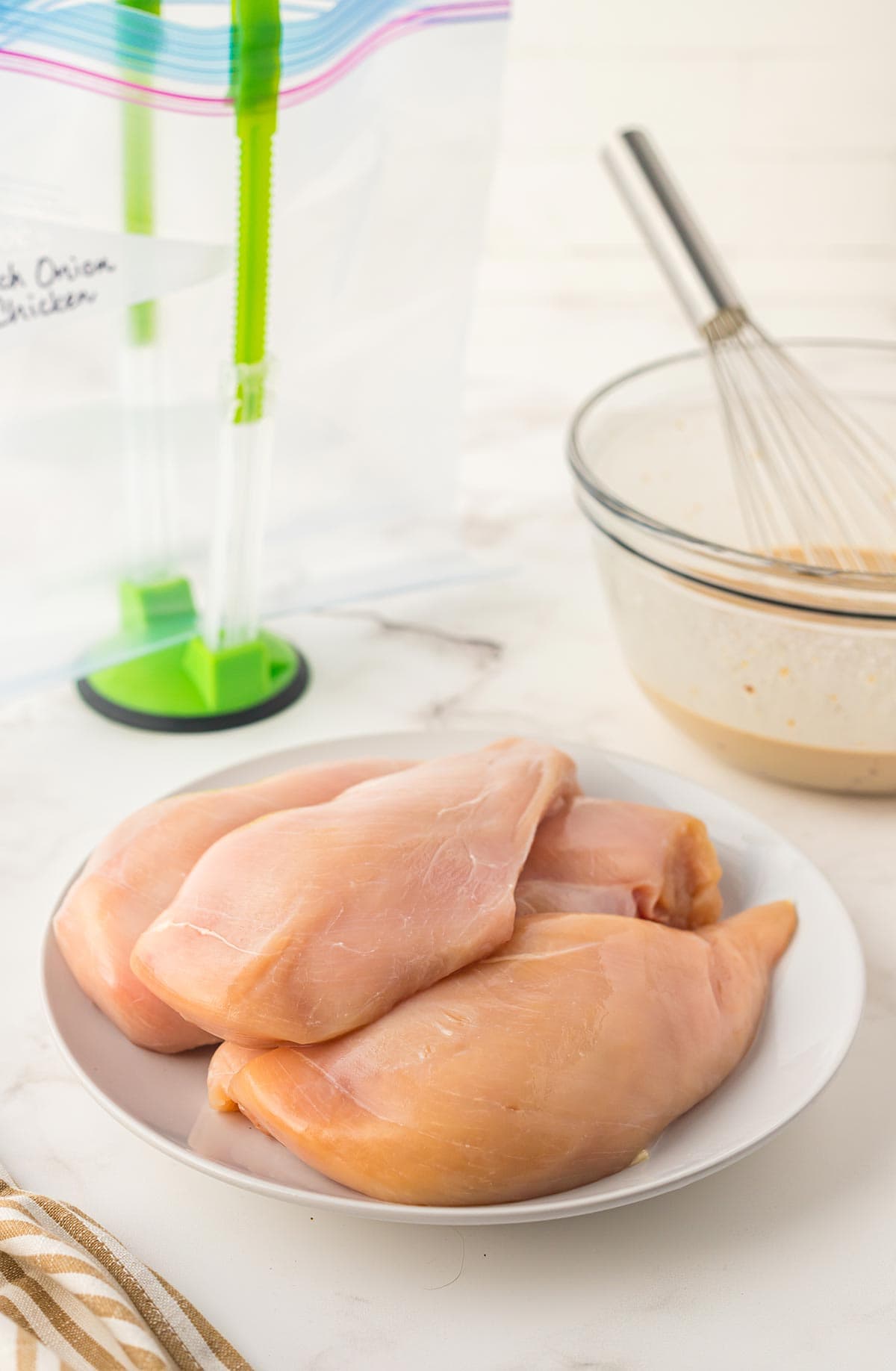 Chicken breasts on a plate.