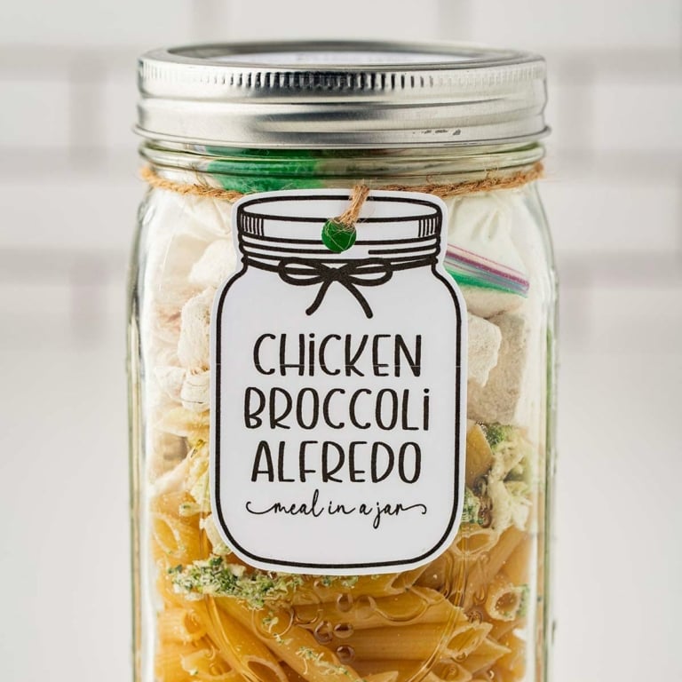 Closeup photo of Chicken Broccoli Alredo Meal in a Jar with tag and label attached for giving as a gift.