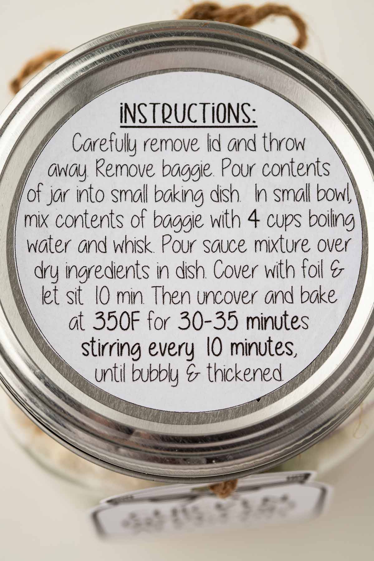 Close-up overhead shot of the instruction label for Chicken Broccoli Alfredo meal in a jar.